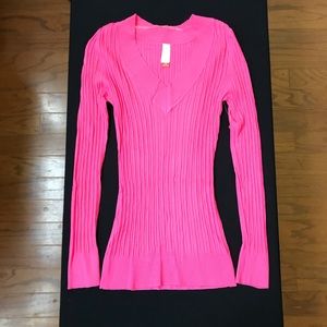 Pink V neck sweater.
